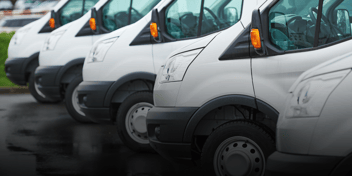 white trucks in a line for commercial auto insurance